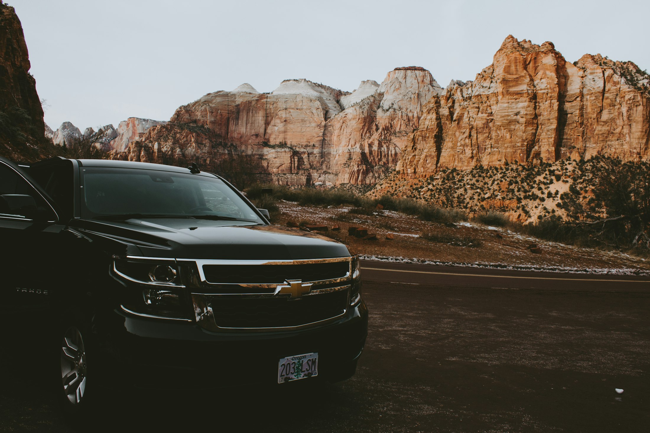 Black Chevrolet Tahoe on a canyon road