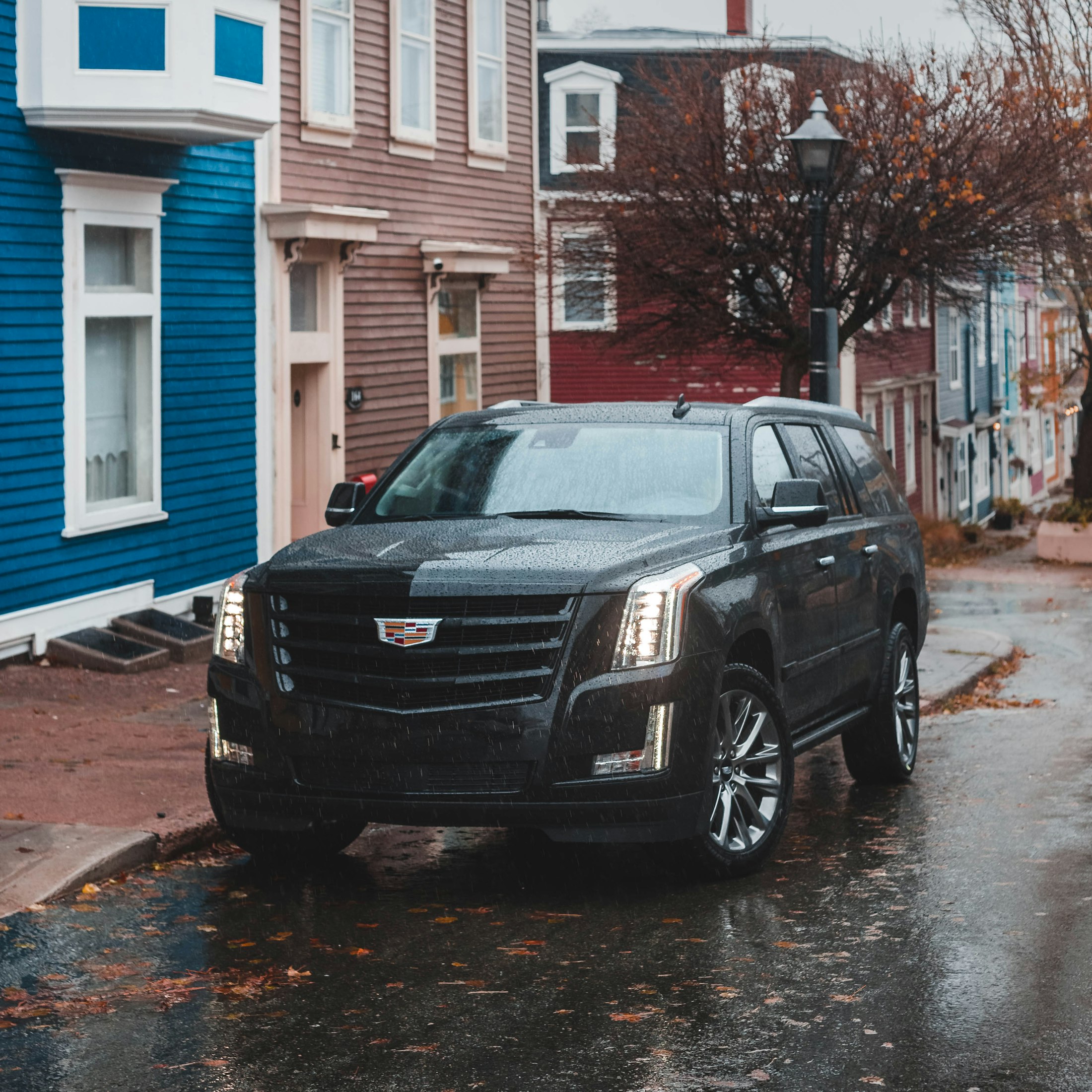 Black Cadillac Escalade parked on a city street